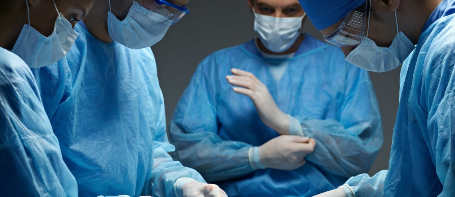 A group of surgeons preparing for surgery.