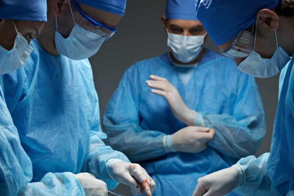 A group of surgeons preparing for surgery.